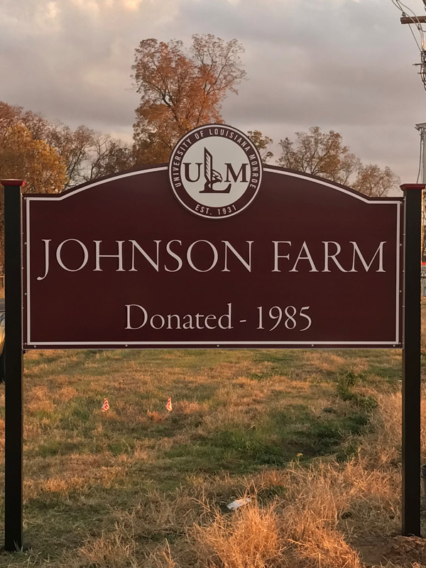 Ella and Morris Johnson Farm sign photo of sign over road