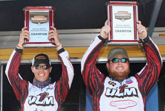 Dustin Perkins (left) and Trapper Munn show off their first place plaques after winning the Carhartt Bassmaster College Series Central Regional Sunday. Photo of ULM Fising Team members
